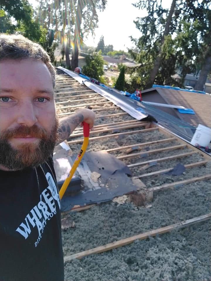 The owner, David Jackson, standing on an unfinished roof.