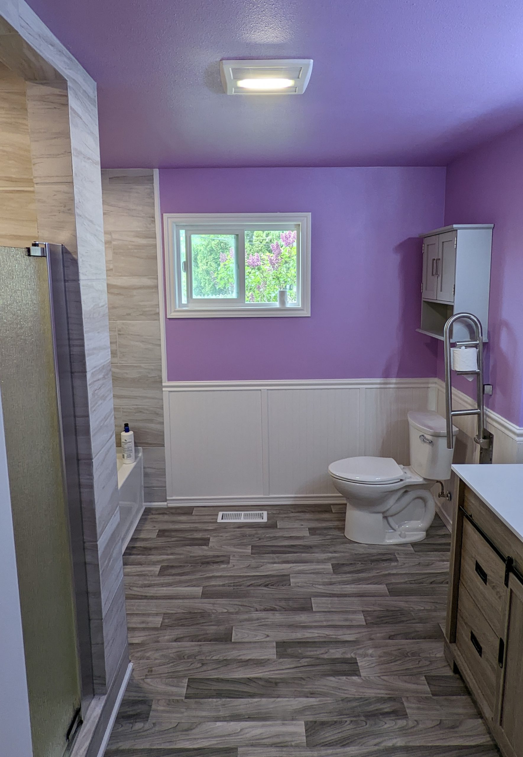 Finished bathroom with purple paint job